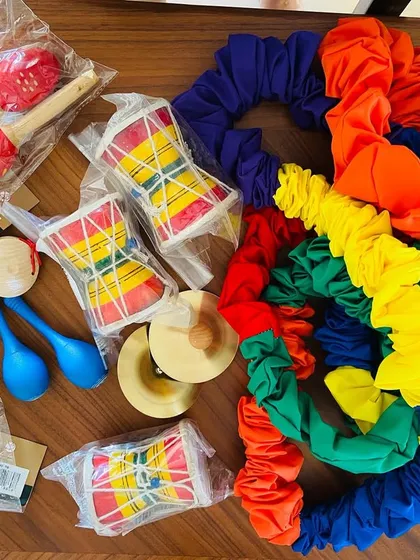 I am always excited to bring new instruments and props to our classes. This collection of maracas, drums, and colorful connect-a-bands ensures there is always something new and exciting for the children to discover and play with.