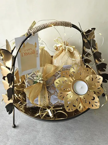 This hamper features a unique butterfly-handled basket, filled with agate-print boxes and a floral T-light holder. It’s a whimsical and elegant gift that is sure to bring a smile.
