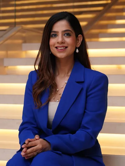 A close-up portrait in my blue suit. The right outfit helps set a professional tone from the start.