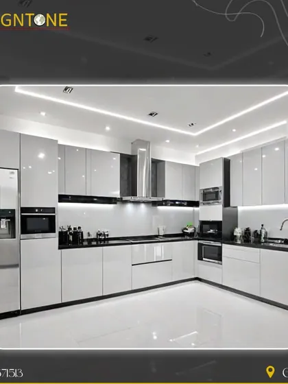 A showcase of a modern, ultra-luxury modular kitchen in a striking high-gloss white and black theme. This L-shaped layout features integrated appliances, handleless cabinets, and layered lighting with spotlights and strip lights, creating a space that is both functional and visually stunning.