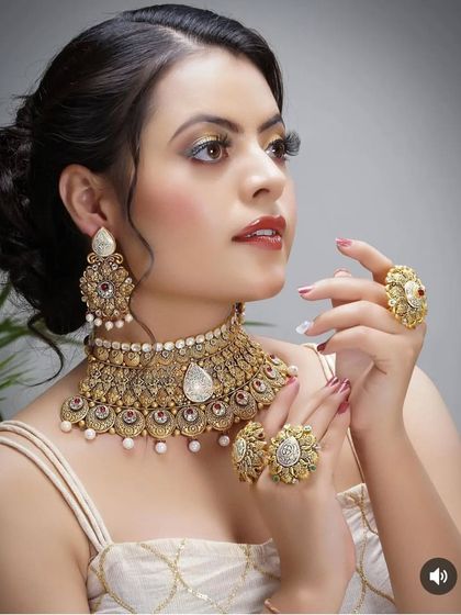 A textured messy bun created for a jewelry lookbook. This style is effortlessly chic and modern, providing a beautiful contrast to the traditional, heavy gold necklace and earrings.