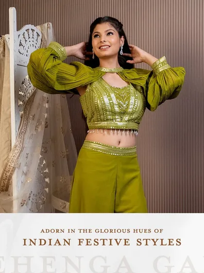 Adorn yourself in the glorious hues of Indian festive styles. This olive green palazzo set with a unique cape-style blouse is a modern and chic choice for a mehendi or sangeet.