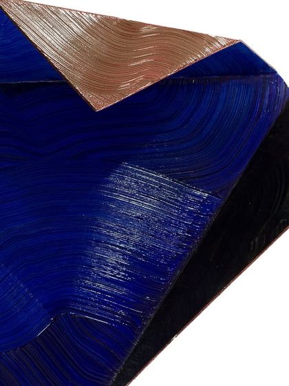 A close-up of the textured planes, showing the brushstrokes and the contrast between the different metallic finishes.