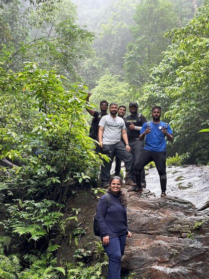 A group of friends taking a break in the forest section of the Kodachadri trail.