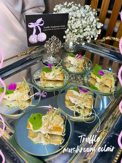 Our popular Truffle Mushroom Éclair, deconstructed and served on small mirrored plates, adding a touch of glamour to the event.