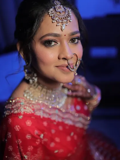 A close-up portrait of a North Indian bride, her eyes beautifully defined and her skin glowing.