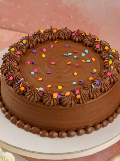 Some flavors never go out of style. My Chocolate Buttercream Cake from the Old School collection features a moist dark chocolate sponge and silky chocolate buttercream, topped with confetti.
