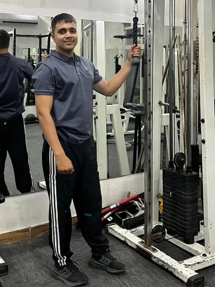 Posing with the gym equipment.