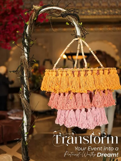 Transforming an event into a Pinterest-worthy dream. This colorful tassel chandelier was a key element in a vibrant, classy wedding theme, adding a touch of bohemian elegance.