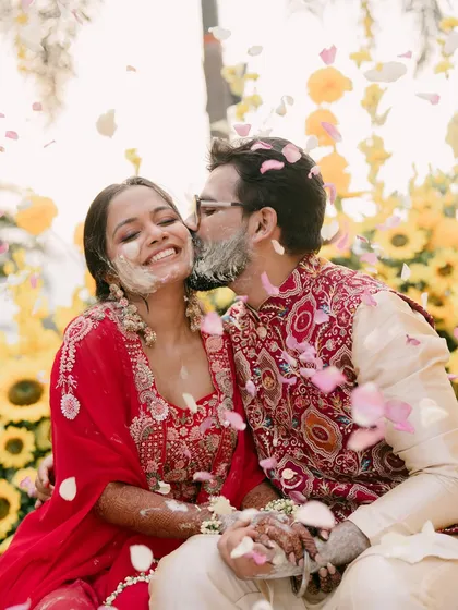 A moment of pure joy and love, as the couple is showered with flower petals during their haldi.