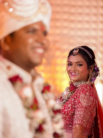 A lovely portrait of the bride looking towards the camera. Her makeup is radiant and perfectly applied, making her the center of attention.
