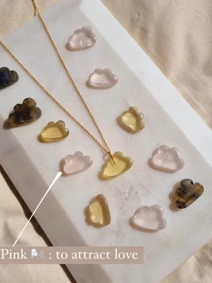 My candy cloud pendants, each with a different purpose. The pink rose quartz is to attract love, while the others offer magic or stress relief.