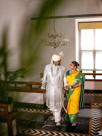 An elegant shot of a Marathi couple walking through the corridors of the Jaypee Residency Manor in Mussoorie.