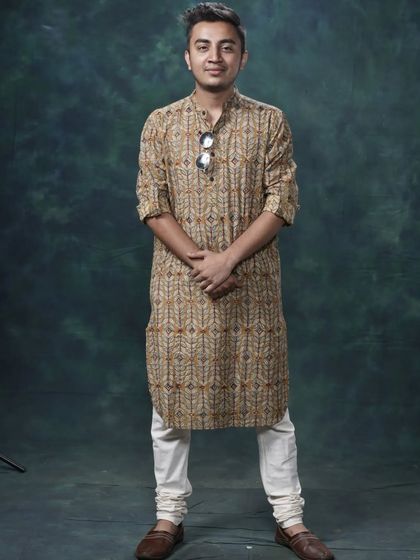 A full-length shot of my typical attire for a daytime wedding function. I blend in with your guests while standing out with the energy I bring to the music.