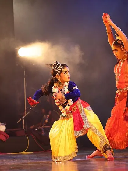 A dynamic interaction between two dancers during our "Nrithya Milanam 2023" show. The energy and precision in their movements highlight the rigorous training behind our performances.