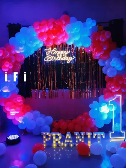 A bold red and blue balloon circle with a shimmer backdrop, perfect for a high-energy birthday party at home.