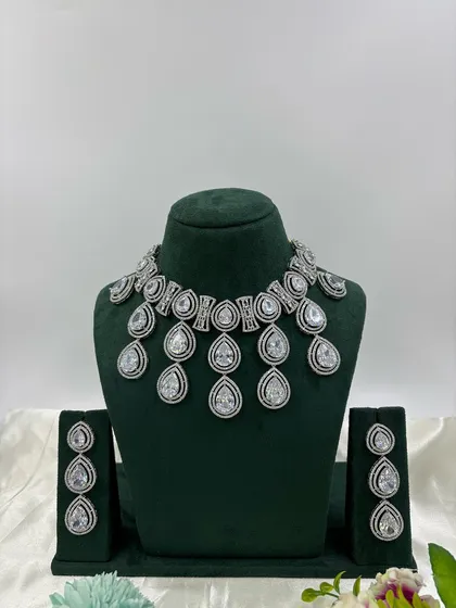 The teardrop necklace with all-white stones.