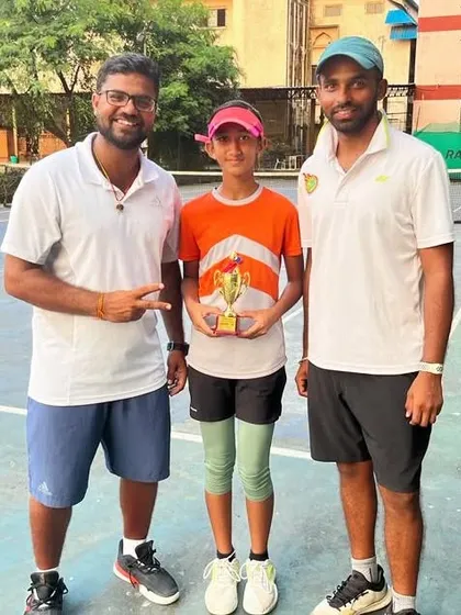 Rumi Gadia with her coaches after her runner-up finish in the Aita Champion series under 14 doubles in Imphal.