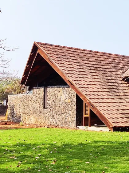 Our Alibaug residence nearing completion. The design features a sloping tiled roof and solid stone walls, materials that are native to the region and provide a sense of permanence and belonging.