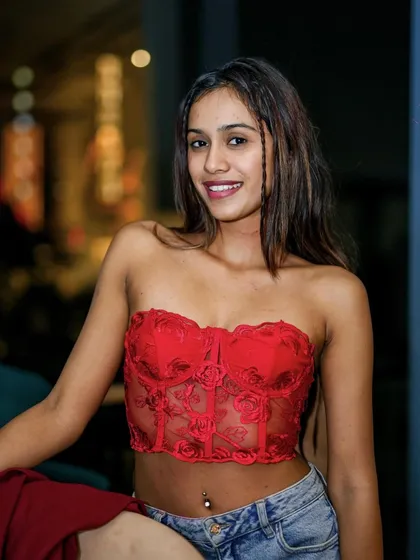 Another guest in a red corset top, embracing the Halloween theme.