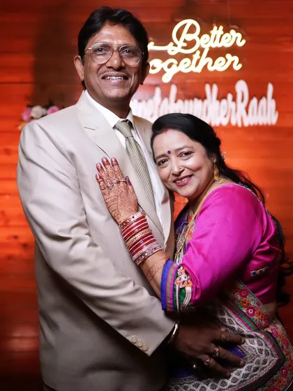 A lovely portrait of the bride's mother-in-law and father-in-law, looking graceful and happy.