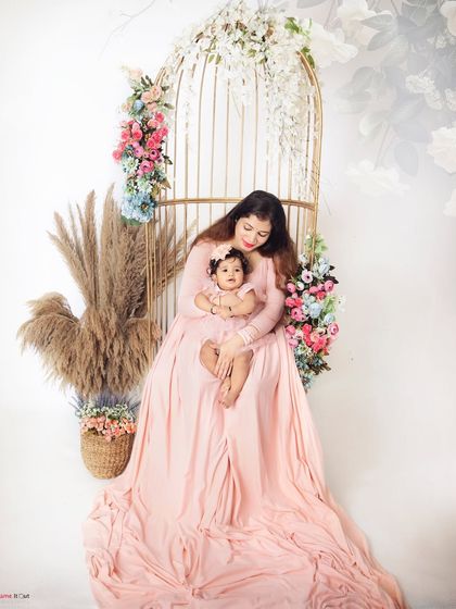 A Mother's Day tribute. This beautiful portrait of a mother and her baby girl in our floral birdcage setup is a celebration of a mother's love.