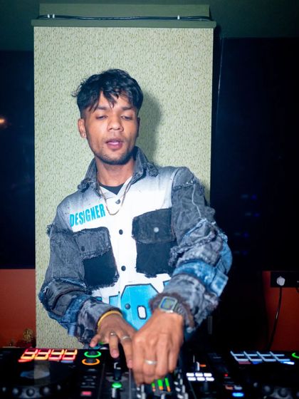 Feeling the music as I prepare to drop the next track.