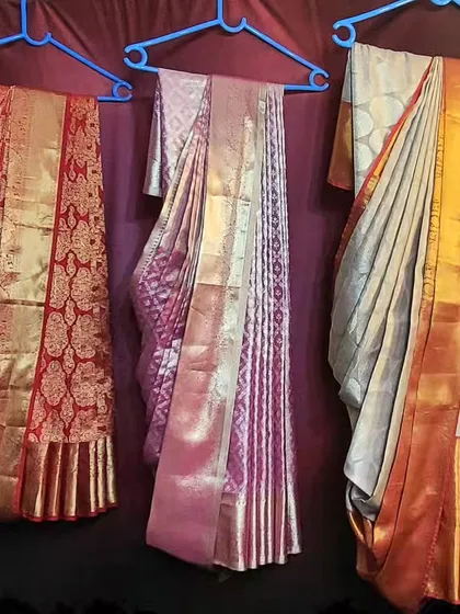 For clients who prefer to store their sarees hanging, I offer the hanger folding option. Here you can see three different bridal sarees, all pre-pleated with fluffy pleats and set on hangers. They are ready to be taken out of the closet and draped in minutes.