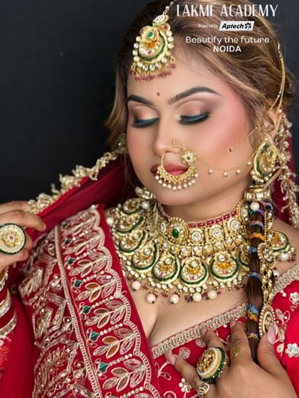 A classic red bridal look with heavy kundan jewelry. Our course covers how to balance bold jewelry with equally stunning makeup for a regal effect.