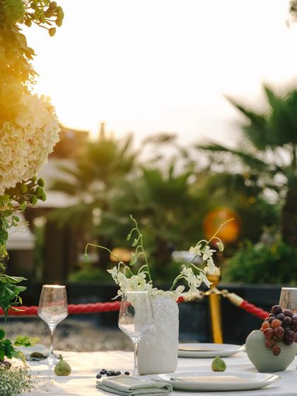 A beautiful shot of the tablescape at sunset, with the soft light enhancing the natural, organic feel of the decor.