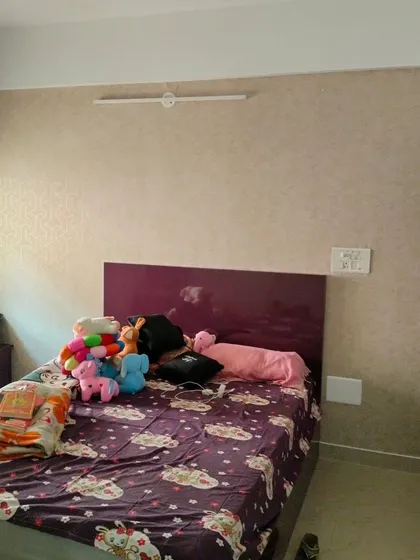 This is another view of a bedroom blind installation in Electronic City, Bangalore. The neutral fabric blind provides a clean finish and works well with the existing room decor.