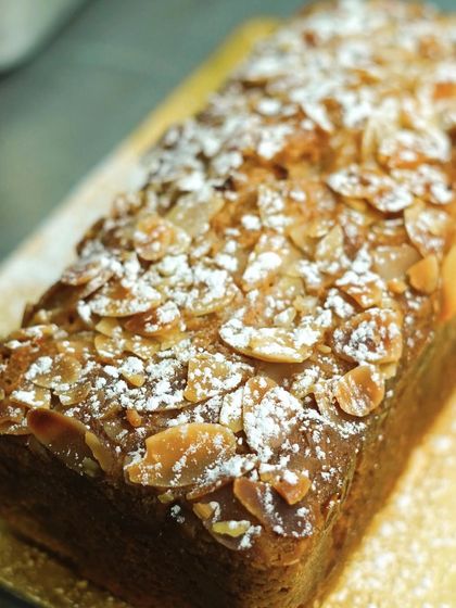 Our Tuscan lemon and almond tea loaf, a wonderfully moist and flavorful cake. This eggless cake is perfect for afternoon tea or as a thoughtful gift.