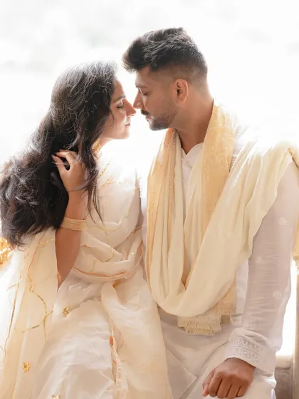Sometimes, the most powerful shots are the quietest. This intimate close-up, with soft natural light, focuses on the unspoken connection and gentle affection between the couple, capturing a pure, candid moment.