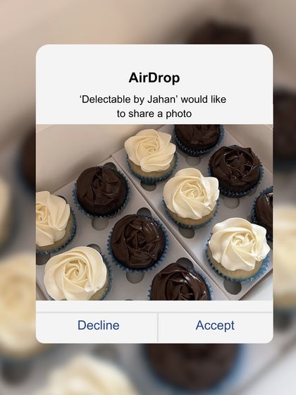 A box of my assorted cupcakes, featuring both vanilla with vanilla buttercream and chocolate with dark chocolate ganache. The simple, elegant rosette piping makes them a crowd-pleaser for any event.