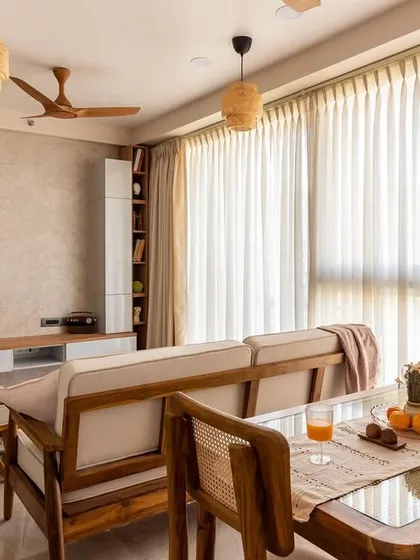 We believe a home should be a sanctuary. This Japandi-style living and dining area uses natural light, warm wood tones, and a clean layout to create a space that feels both expansive and serene, perfect for a modern Mumbai apartment.