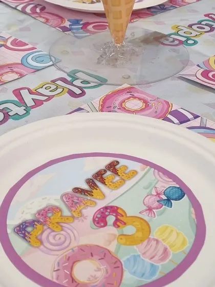 The details make the party. For our Candyland theme, we even provide personalized, themed plates and table settings to complete the immersive experience.