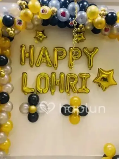 This Lohri decoration uses large "Happy Lohri" foil letter balloons as the centerpiece. I created a balloon arch around it using a classic color combination of yellow, black, and silver to make the message stand out.