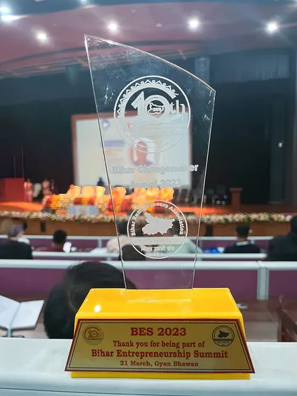 A duplicate of ID 83, this photo of the award on stage at the Bihar Entrepreneurship Summit marks a proud moment for my entire team.