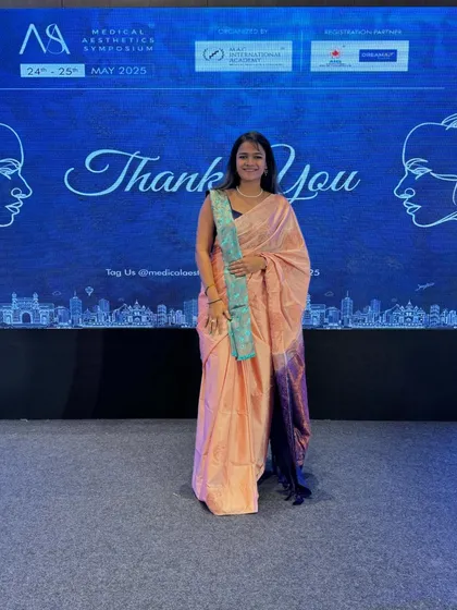 My look for Day 1 of the symposium, an elegant peach saree that brought a traditional touch to the corporate event.