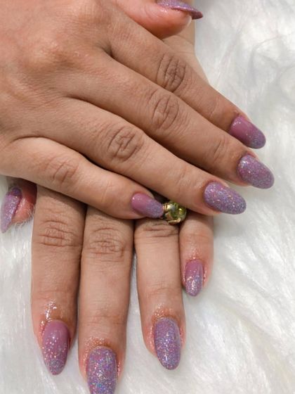 Another look at the magical, shimmery finish of these unicorn glitter nails.