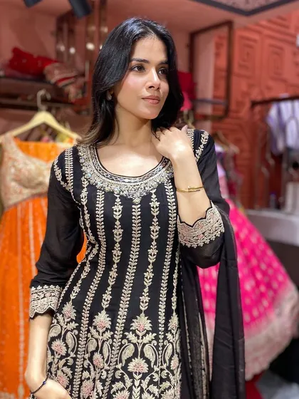 Discover the allure of this black embroidered kali suit, where intricate details meet a classic silhouette.