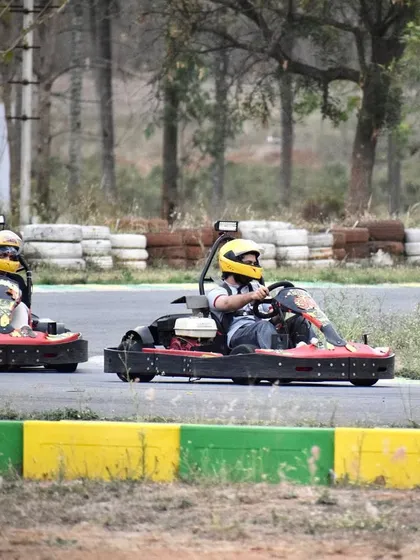 Turn left to make the right turn. Two drivers navigate a corner, showcasing the technical aspects of our track layout.
