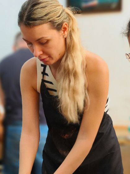 A student from abroad concentrates on her project. Our mission is to spread true art knowledge and revive India's artistic glory, welcoming everyone to be a part of the journey.