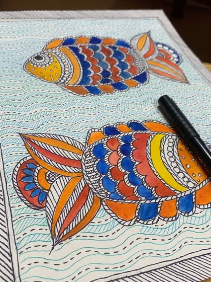 Can you guess which art form this is? A fun quiz featuring a student's beautiful Madhubani fish painting, filled with colorful, intricate patterns.
