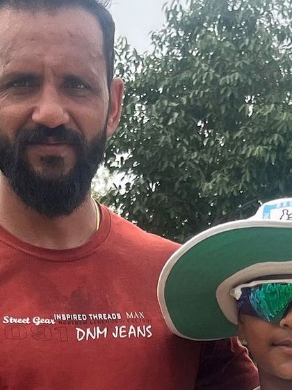 Tanish Bhardwaj, our best fielder, with his coach. His agility on the field is exceptional.