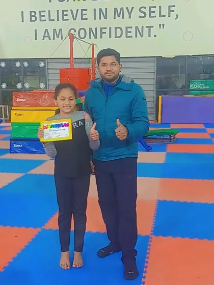 Thumbs up from the coach for this student's latest achievement.
