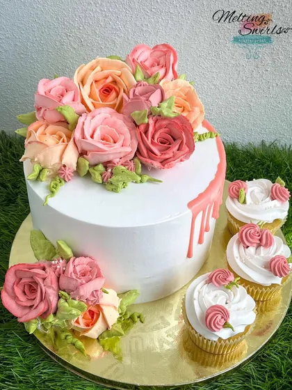 We believe the frosting should be as delicious as the cake itself. This cake showcases our skill with hand-piped whipped cream roses, creating a beautiful floral arrangement that is completely edible and wonderfully light.