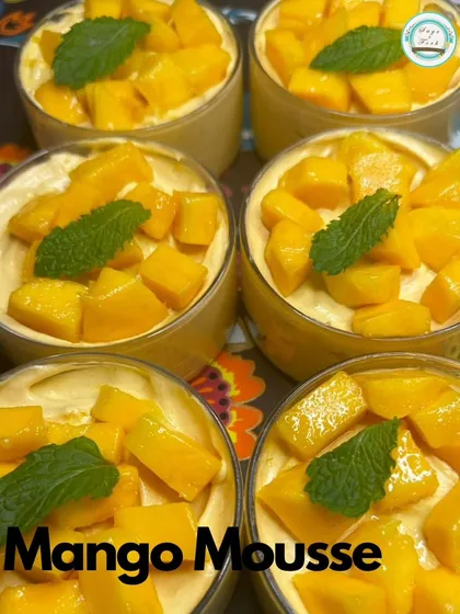 A close-up of my fresh Mango Mousse cups. The vibrant color and fresh mint garnish make this dessert as beautiful as it is delicious.