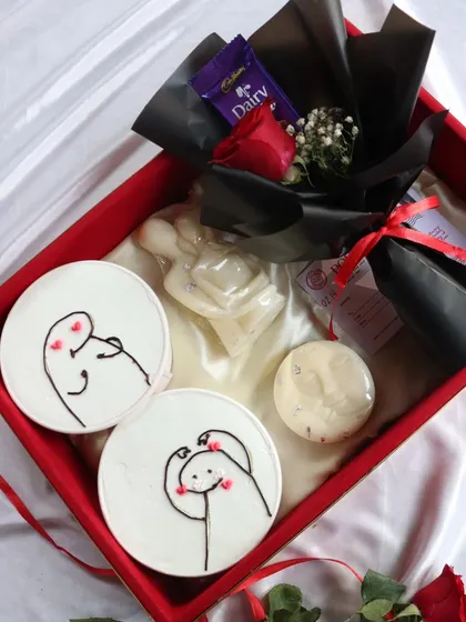 Another view of the "Decadent Love" hamper, showcasing the arrangement of the dessert tubs and romantic extras.