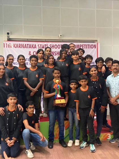 Our team with the Rolling Trophy from the Karnataka State Rifle Association for the third consecutive time. This trophy symbolizes our consistent dominance in state-level competitions.
